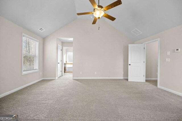 unfurnished living room with ceiling fan, carpet, baseboards, lofted ceiling, and visible vents