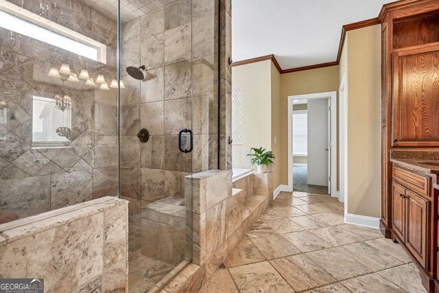 full bath featuring baseboards, ornamental molding, tiled shower, a garden tub, and stone tile flooring