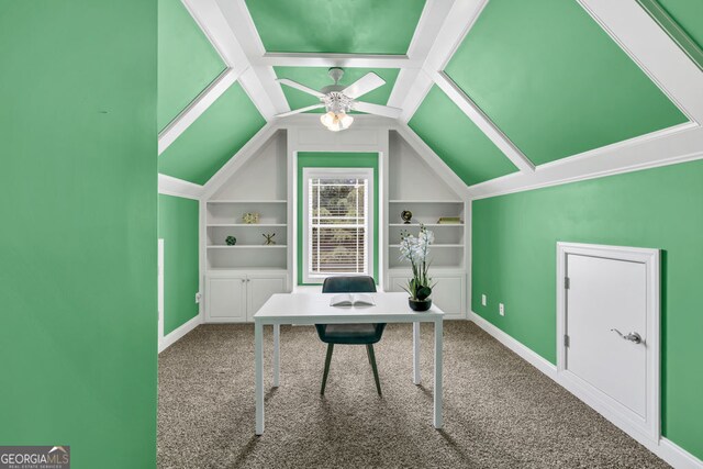 carpeted office space with baseboards, built in features, ceiling fan, and lofted ceiling