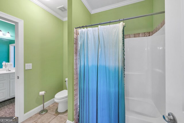bathroom featuring visible vents, ornamental molding, vanity, toilet, and baseboards