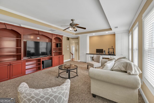 living room with a healthy amount of sunlight, carpet floors, and baseboards