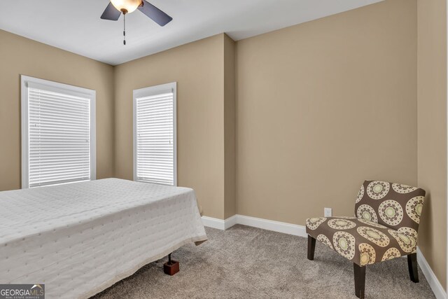 bedroom with carpet floors, a ceiling fan, and baseboards
