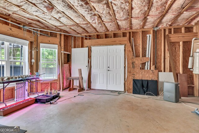 misc room with concrete flooring