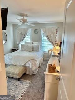 carpeted bedroom with ceiling fan