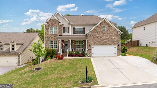 7730 Tiberon Pkwy, Cumming, GA 30028 - craftsman house with a garage, a front lawn, covered porch, brick siding, and driveway