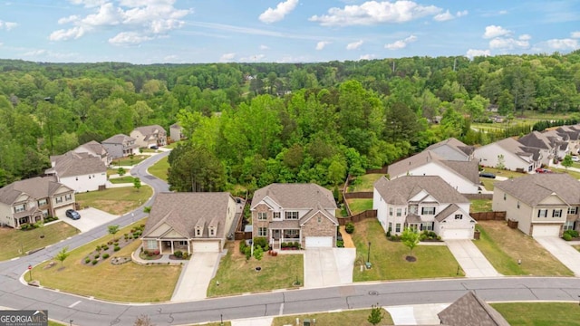 7730 Tiberon Pkwy, Cumming, GA 30028 - drone / aerial view featuring a residential view and a wooded view