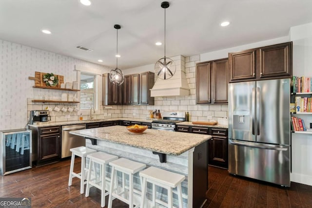 7730 Tiberon Pkwy, Cumming, GA 30028 - kitchen featuring visible vents, open shelves, dark brown cabinets, a sink, and stainless steel appliances