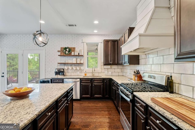 7730 Tiberon Pkwy, Cumming, GA 30028 - kitchen with visible vents, custom exhaust hood, wallpapered walls, a sink, and stainless steel appliances