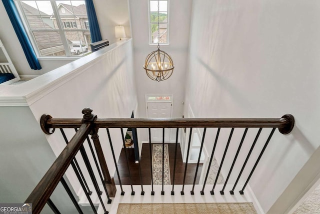 7730 Tiberon Pkwy, Cumming, GA 30028 - stairway with an inviting chandelier