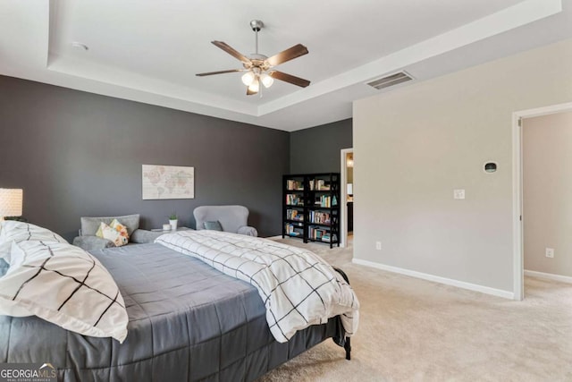 7730 Tiberon Pkwy, Cumming, GA 30028 - bedroom featuring baseboards, a tray ceiling, light carpet, and visible vents