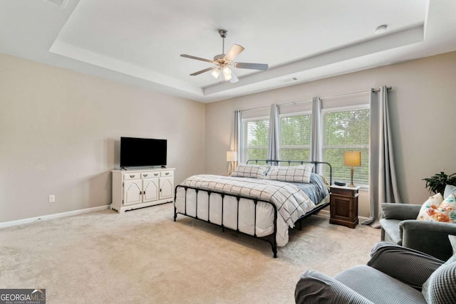 7730 Tiberon Pkwy, Cumming, GA 30028 - bedroom featuring a raised ceiling, baseboards, ceiling fan, and light colored carpet