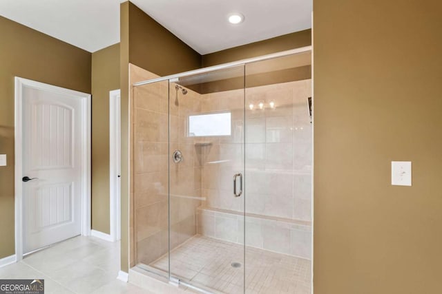 7730 Tiberon Pkwy, Cumming, GA 30028 - bathroom featuring tile patterned flooring, baseboards, and a shower stall
