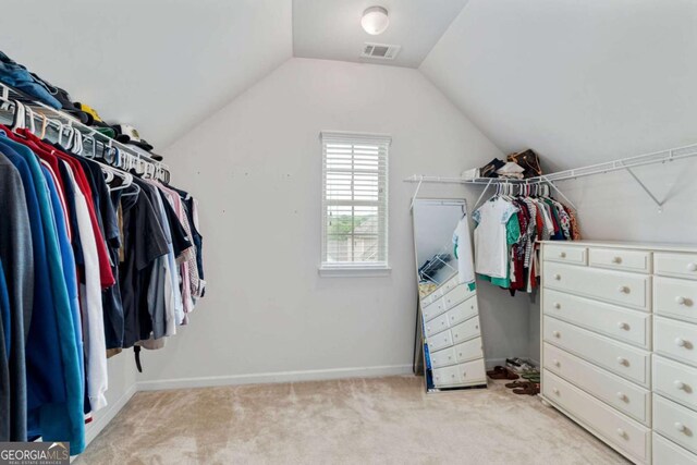 7730 Tiberon Pkwy, Cumming, GA 30028 - walk in closet featuring visible vents, carpet, and lofted ceiling