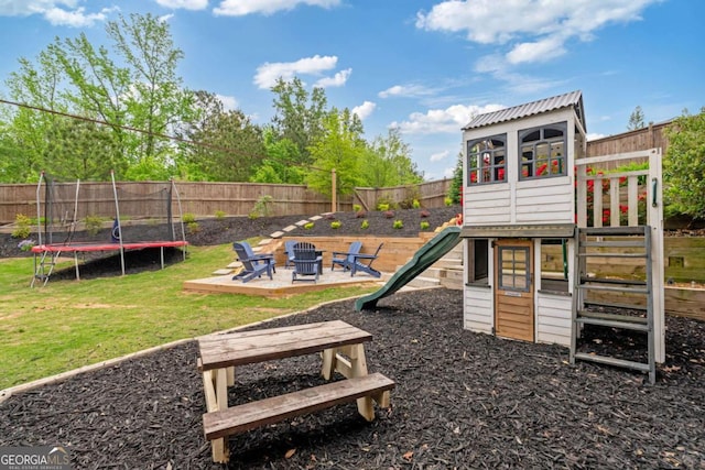 7730 Tiberon Pkwy, Cumming, GA 30028 - view of play area featuring a lawn, a fire pit, a fenced backyard, and a trampoline