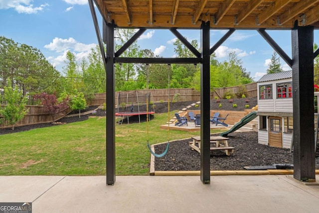 7730 Tiberon Pkwy, Cumming, GA 30028 - view of play area with a fenced backyard, a trampoline, a yard, and a patio