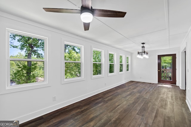 unfurnished sunroom featuring plenty of natural light and an inviting chandelier