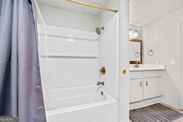 bathroom featuring vanity, baseboards, and shower / bath combination with curtain