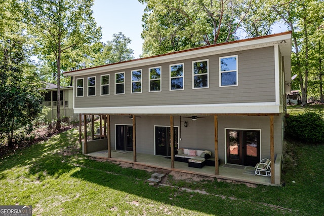 back of house featuring an outdoor hangout area, a ceiling fan, a patio, and a yard