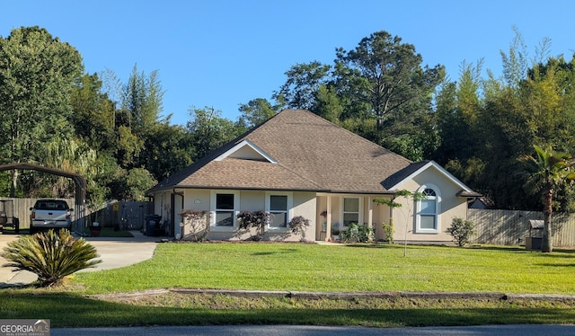 ranch-style home featuring stucco siding, fence, a front yard, and a carport