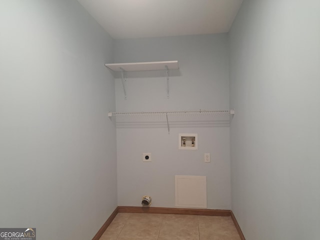 washroom with laundry area, baseboards, electric dryer hookup, washer hookup, and light tile patterned floors