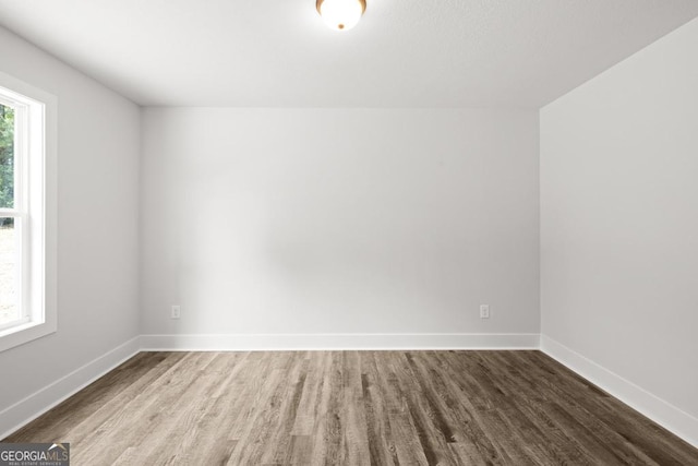 3261 Broadnax Mill Rd Unit 2, Loganville, GA 30052 - unfurnished room with baseboards and wood finished floors