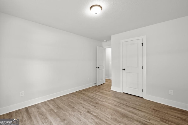 3261 Broadnax Mill Rd Unit 2, Loganville, GA 30052 - spare room with baseboards and wood finished floors