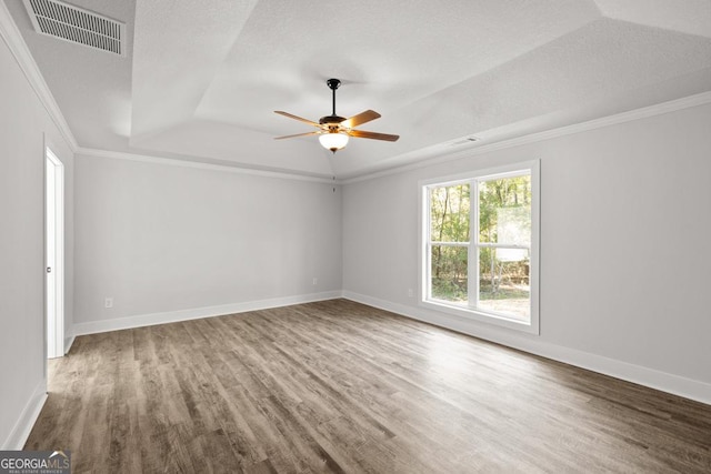 3261 Broadnax Mill Rd Unit 2, Loganville, GA 30052 - empty room with visible vents, a raised ceiling, ceiling fan, and wood finished floors