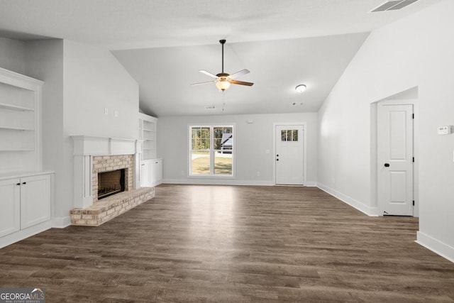 3261 Broadnax Mill Rd Unit 2, Loganville, GA 30052 - unfurnished living room with built in features, a fireplace, baseboards, ceiling fan, and dark wood-type flooring