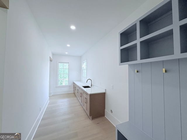 5753 Brendlynn Dr, Suwanee, GA 30024 - laundry area featuring light wood-style flooring and recessed lighting