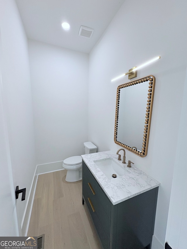 5753 Brendlynn Dr, Suwanee, GA 30024 - bathroom featuring vanity and wood finished floors