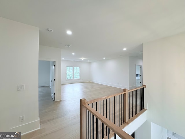5753 Brendlynn Dr, Suwanee, GA 30024 - hallway with an upstairs landing, light wood-type flooring, and recessed lighting