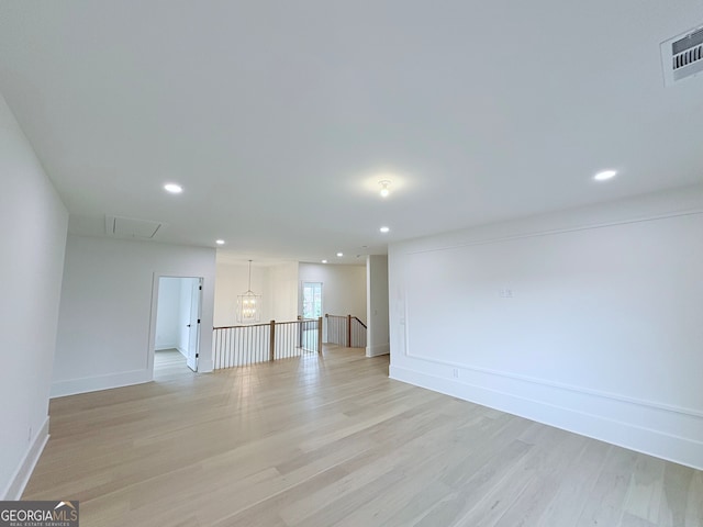 5753 Brendlynn Dr, Suwanee, GA 30024 - unfurnished room featuring light wood finished floors and recessed lighting