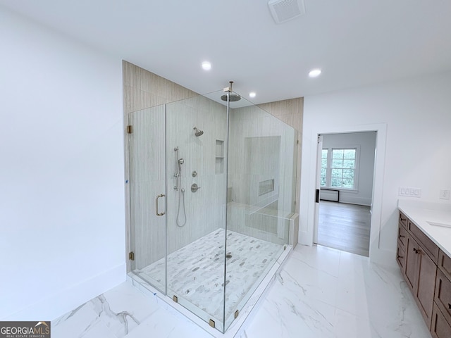 5753 Brendlynn Dr, Suwanee, GA 30024 - bathroom with a shower stall, recessed lighting, vanity, and marble finish floors