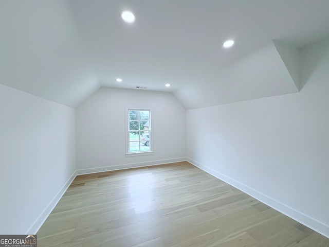 5753 Brendlynn Dr, Suwanee, GA 30024 - bonus room featuring vaulted ceiling, light wood-style floors, and recessed lighting