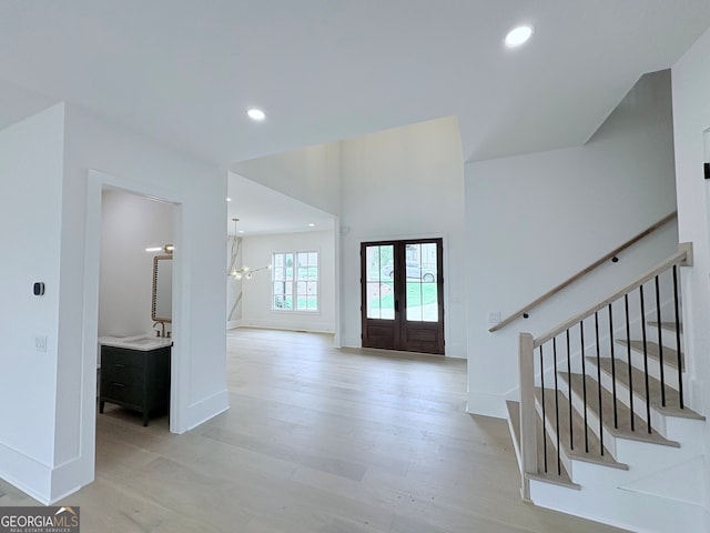 5753 Brendlynn Dr, Suwanee, GA 30024 - entryway with french doors, light wood-type flooring, stairway, and recessed lighting
