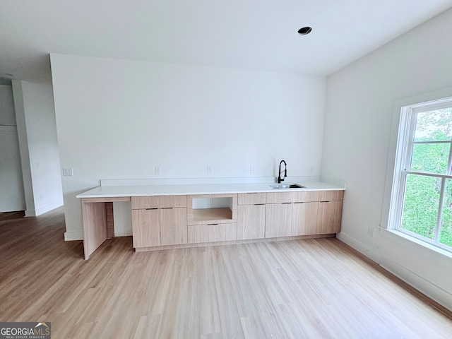 5753 Brendlynn Dr, Suwanee, GA 30024 - bar with light wood-style floors, a sink, and baseboards