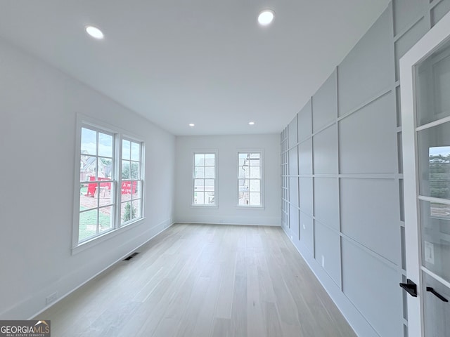 5753 Brendlynn Dr, Suwanee, GA 30024 - unfurnished room featuring recessed lighting and light wood finished floors