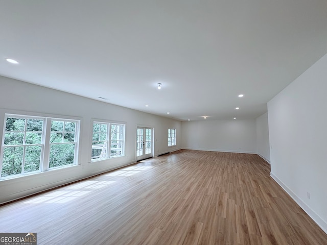 5753 Brendlynn Dr, Suwanee, GA 30024 - spare room featuring light wood-style flooring and recessed lighting