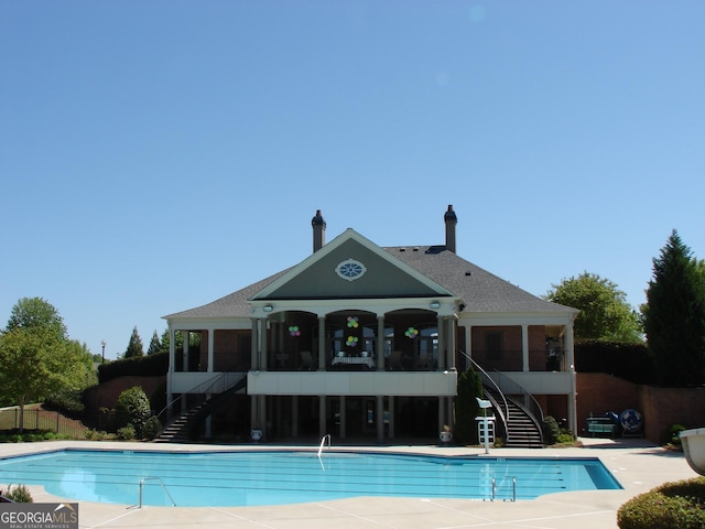 5753 Brendlynn Dr, Suwanee, GA 30024 - community pool featuring stairs and a sunroom