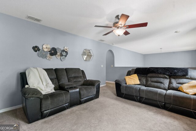 224 Pine Bluff Dr, Kingsland, GA 31548 - carpeted living area with arched walkways, ceiling fan, baseboards, and visible vents
