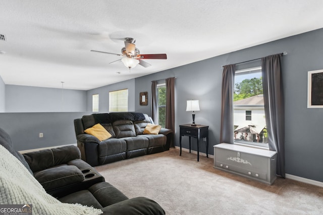 224 Pine Bluff Dr, Kingsland, GA 31548 - living room with baseboards, a ceiling fan, carpet flooring, and visible vents