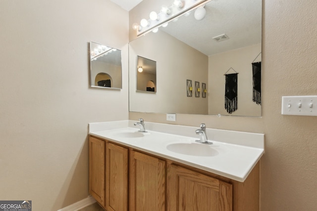 224 Pine Bluff Dr, Kingsland, GA 31548 - full bath with double vanity, visible vents, and a sink