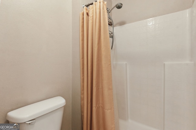 224 Pine Bluff Dr, Kingsland, GA 31548 - bathroom with a stall shower and toilet