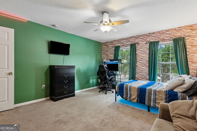 224 Pine Bluff Dr, Kingsland, GA 31548 - carpeted bedroom with baseboards, ceiling fan, and a textured ceiling