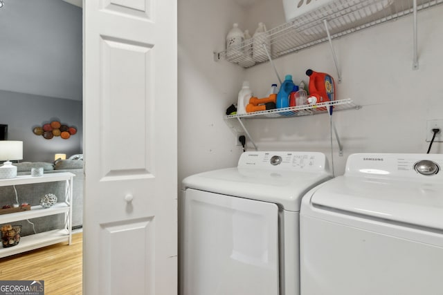 224 Pine Bluff Dr, Kingsland, GA 31548 - laundry area featuring separate washer and dryer, laundry area, and light wood-type flooring