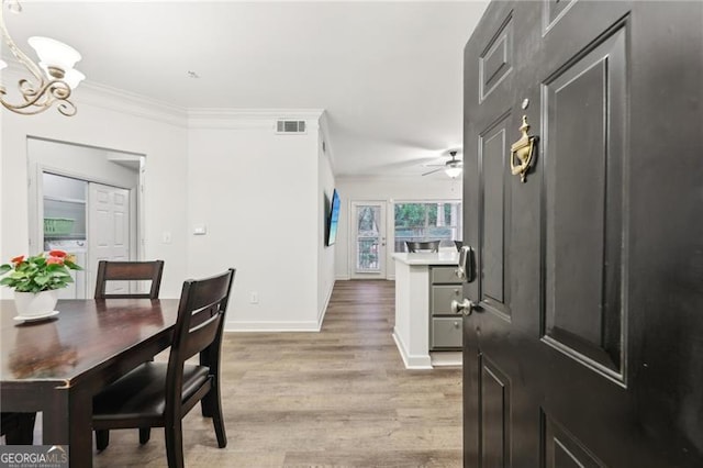 5559 Glenridge Dr Unit 1103, Sandy Springs, GA 30342 - living area featuring crown molding, a ceiling fan, and light wood-style flooring