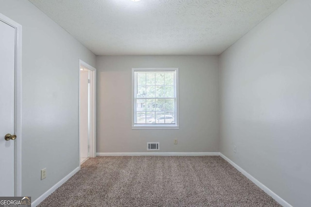 8431 Magnolia Dr, Jonesboro, GA 30238 - spare room with carpet, visible vents, and baseboards