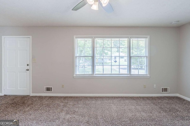 8431 Magnolia Dr, Jonesboro, GA 30238 - carpeted spare room with baseboards, a wealth of natural light, visible vents, and a ceiling fan