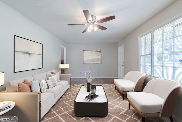 8431 Magnolia Dr, Jonesboro, GA 30238 - living room with ceiling fan, baseboards, and visible vents