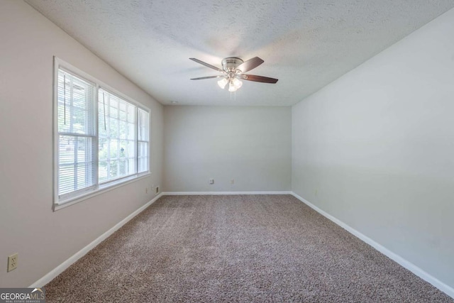 8431 Magnolia Dr, Jonesboro, GA 30238 - carpeted spare room with a ceiling fan, baseboards, and a textured ceiling